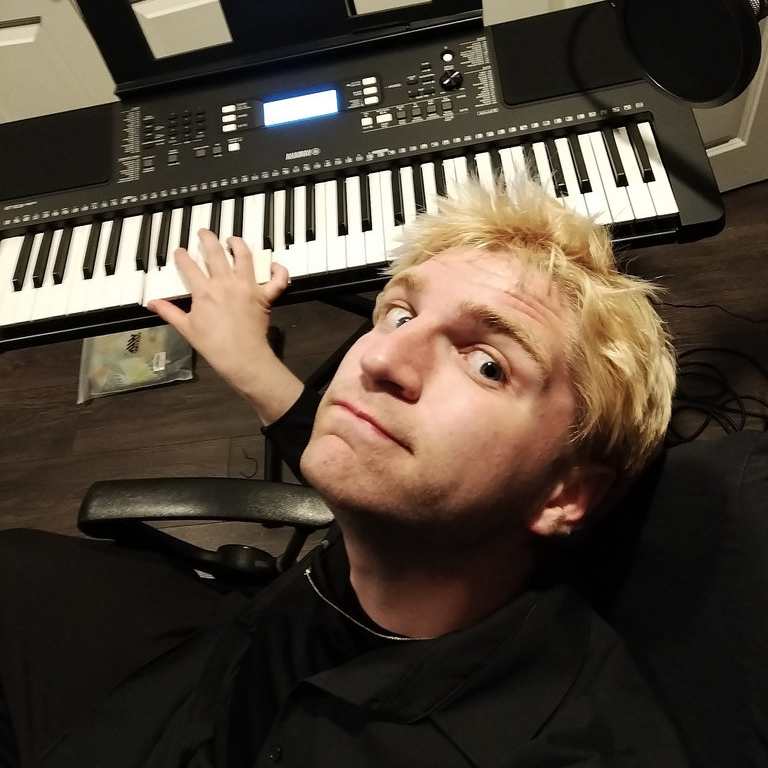 Photo of Scotty Rich playing a Yamaha piano